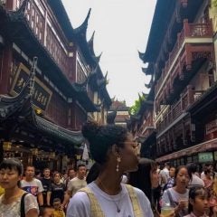 Woman standing in busy chinese town