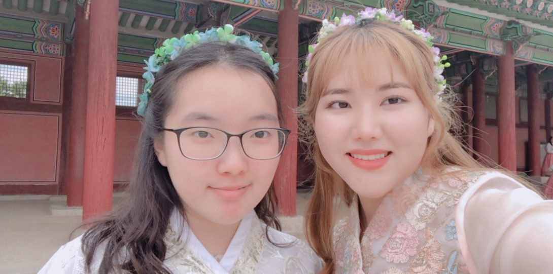 Two students in front of Gyeongbokgung Palace