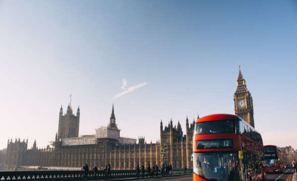 Palace of Westminster and a red bus in London